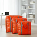 Three orange storage bags with gray handles for your home organization. Let's organize together.