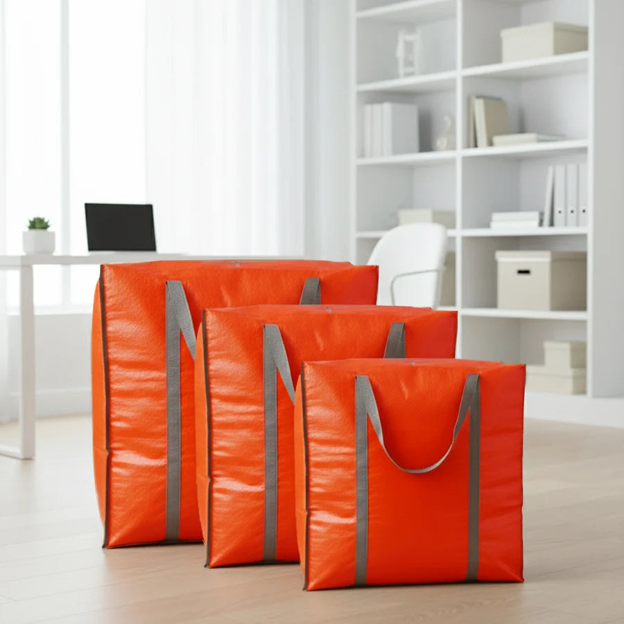 Three orange Carge/storage bags with gray handles for you to organize and manage your stuff at home or for travelling.